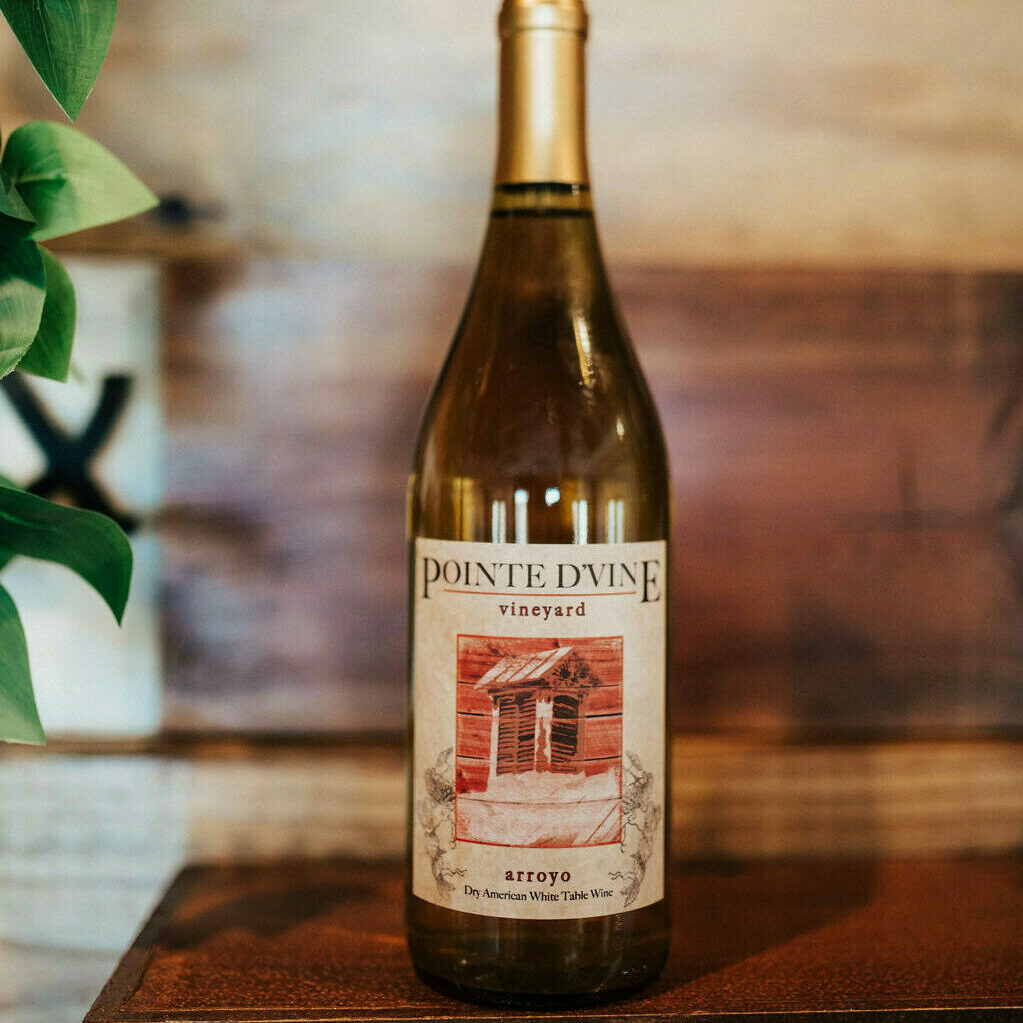 arroyo white wine on wood shelf